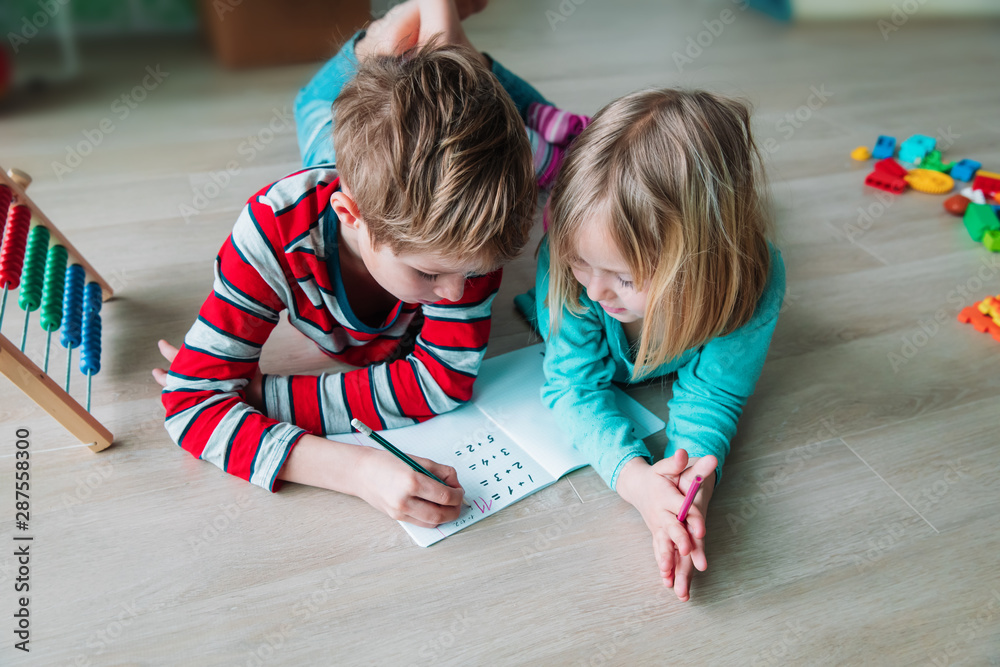 Wall mural boy and girl learn to count and write numbers
