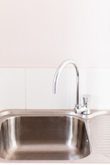 Faucet sink at kitchen