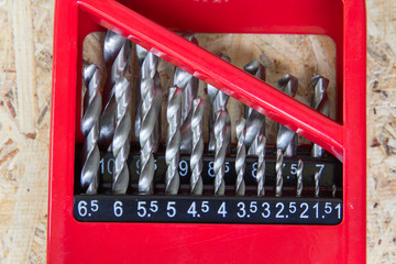 drill set,drill for metal in set on wooden background