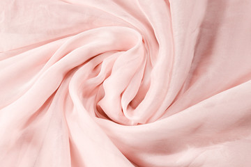 Obraz premium Soft smooth pink silk fabric background. Fabric texture.