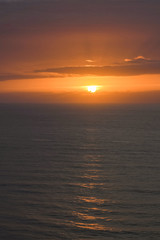 Fototapeta premium sun at sunset on the horizon in the sea