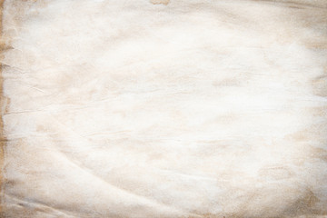 Old brown and white paper stained with coffee.