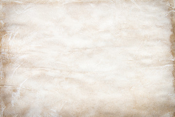 Old brown and white paper stained with coffee. Vintage abstract background.