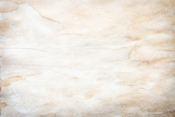 Old brown and white paper stained with coffee. Vintage abstract background.