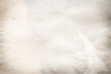 Old brown and white paper stained with coffee. Vintage abstract background.