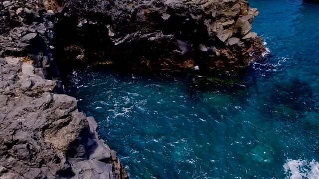Waves hitting the northern coast of Madeira island in the middle of the Atlantic Ocean. Slow motion clip at half speed.