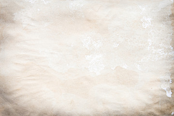 Old brown and white paper stained with coffee. Vintage abstract background.