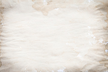 Old brown and white paper stained with coffee. Vintage abstract background.