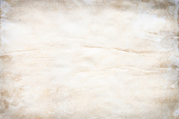 Old brown and white paper stained with coffee. Vintage abstract background.