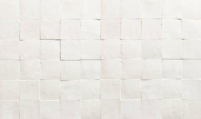 Old retro white ceramic tile texture background. White square tiled wall.
