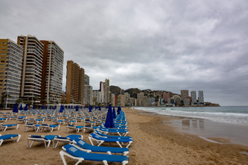 Empty beach of Benidorm at cloudy day