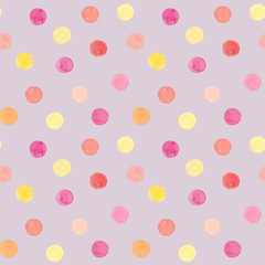 Watercolor hand drawn polka dots seamless pattern in peach color with pink, yellow, orange circles on lilac background 