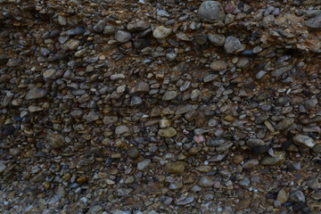 pebble stone texture near the sea on the rocks