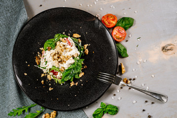 Fresh tasty green salad on the wooden background
