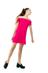 A cheerful little girl is dancing.