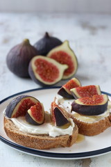 Sandwich with figs and honey,  cream cheese,honey and bread slice