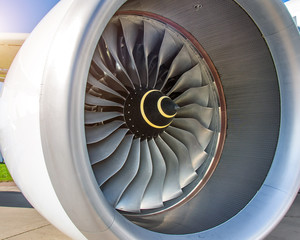 Close up of engine turbofan turbine blades jet engine in modern airplane.