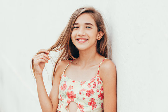 Outdoor portrait of 12 years old girl with long hair