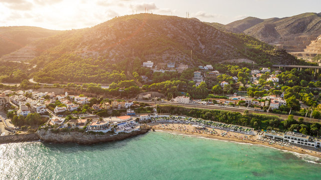 Beautiful Spain sunset. Garraf province of Barcelona, Catalonia, northern Spain. Beautiful view to the city from the sea. Aerial photo