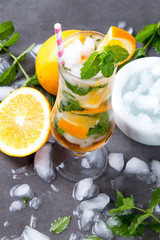 Mohito lime drinks on wooden with blur beach background. Fresh drinks with fruits on wood. Summer concept