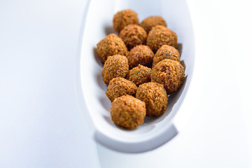 Fantastic and irresistible platter of just-fried falafel balls. Traditional Middle Eastern food.Copy space for text.