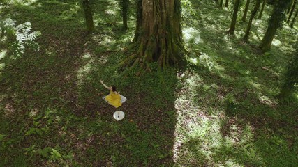 Woman doing yoga in forest