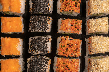 variety of sushi rolls as a background