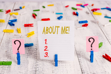 Text sign showing About Me. Business photo showcasing telling someone list of your good and bad traits and past events Scribbled and crumbling sheet with paper clips placed on the wooden table