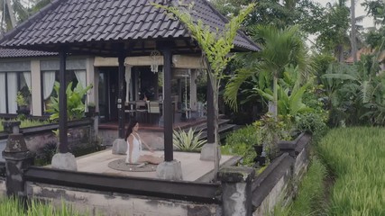 Young woman meditating outside