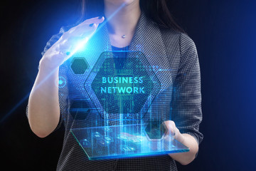The concept of business, technology, the Internet and the network. A young entrepreneur working on a virtual screen of the future and sees the inscription: Business network