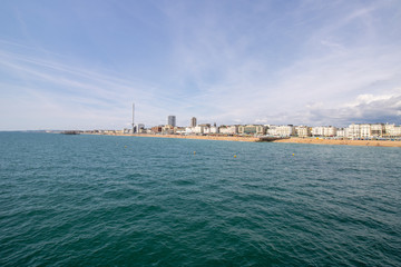 Naklejka premium Brighton UK, 10th July 2019: The famous beautiful Brighton Beach and Seafront showing the coastline area on a bright sunny day,