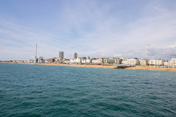 Brighton UK, 10th July 2019: The famous beautiful Brighton Beach and Seafront showing the coastline area on a bright sunny day,