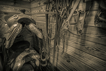 sepia barn and riding saddle