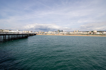 Fototapeta na wymiar Brighton UK, 10th July 2019: The famous beautiful Brighton Beach and Seafront showing the coastline area on a bright sunny day,
