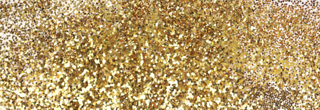 Gold (bronze) glitter shine dots confetti. Abstract light blur blink sparkle defocus backgound.