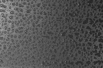 Many surface liquid water drop images on a black background
