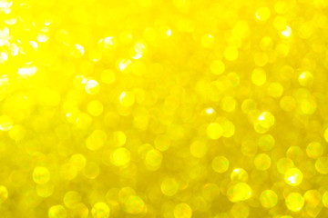 gold bright festive background for Christmas. gold glitter sparkles ray lights bokeh background With Blinking light.can be used for background or wallpaper.