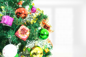 Tree and Christmas decorations. Beautiful decorated with present boxes in a winter landscape with snow. 