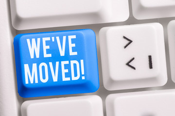 Text sign showing We Ve Moved. Business photo showcasing having strong feelings sadness or sympathy has said or done White pc keyboard with empty note paper above white background key copy space