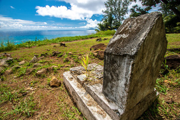 Old gravestone at a scenic part of Silhouette Island, Seychelles