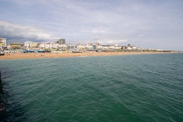 Fototapeta premium Brighton UK, 10th July 2019: The famous beautiful Brighton Beach and Seafront showing the coastline area on a bright sunny day,