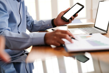 businessman using smart phone. startup man working at workplace