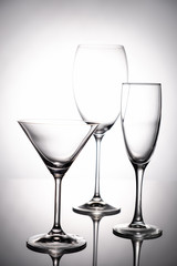 Empty glass goblets set. On a white background abstract