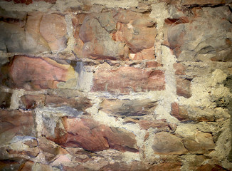 antique stone wall masonry on a city street