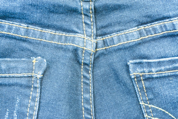 Fototapeta premium Jeans missing fashion. denim jeans background with seam of jeans fashion design. stitched texture denim background of fashion design. good for background.