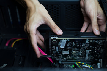 Computer repair and maintenance, Technician is fixing computer at night, Close-up