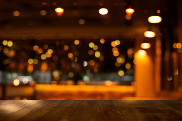 top of wood table with bokeh of glor blur lamp light in party bar or pub in the Christmas night background - obrazy, fototapety, plakaty