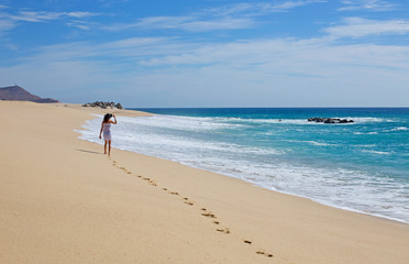 Mature caucasian beautiful woman on the beach