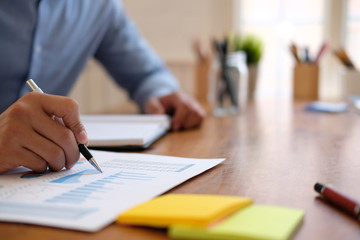businessman working with document. startup man analyze financial data at workplace.