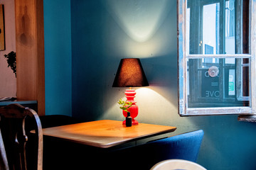 Blue room with table and lamp